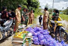 Kodim 1013 MTW dan BPBD Donasikan Bansos kepada Korban Banjir di Desa Sei Rahayu I