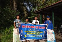 Personel Ditpolairud Polda Kalteng Bersama Masyarakat Teweh Bersihkan Sampah di Pesisir Sungai Barito